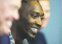  ?? SHABAN ATHUMAN/THE DALLAS MORNING NEWS VIA AP ?? Cowboys defensive end Demarcus Lawrence, center, laughs during a news conference Tuesday at The Star in Frisco, Texas. The 26-year-old Lawrence signed a $105 million, five-year contract with $65 million guaranteed.