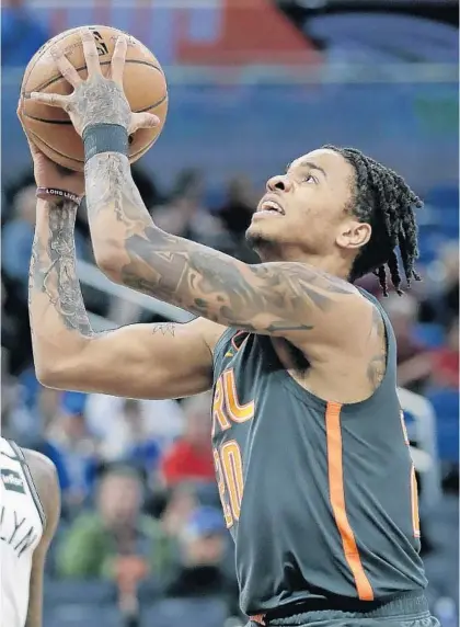  ?? JOHN RAOUX/AP ?? Guard Markelle Fultz goes up for a shot against the Nets in the first half Monday night at Amway Center. Fultz scored a career-high 25 points.