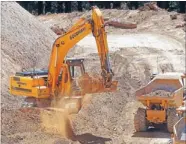  ?? Photo: FAIRFAX NZ ?? Under way: A digger on the access road to the $169 million Mill Creek wind farm.