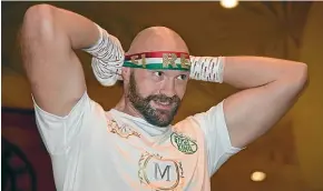  ?? GETTY IMAGES ?? Boxer Tyson Fury ties a headband on as he prepares to work out ahead of his fight against Otto Wallin in Las Vegas on Sunday (NZ time).