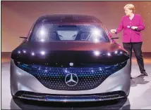  ??  ?? German Chancellor Angela Merkel stands next to a Mercedes during her
visit to the IAA Auto Show in Frankfurt, Germany, on Sept 12. (AP)