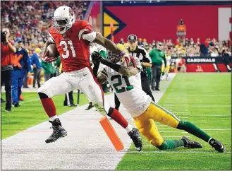  ?? ROSS D. FRANKLIN/THE ASSOCIATED PRESS ?? Arizona Cardinals running back David Johnson (31) runs for a touchdown Sunday afternoon in Glendale, Ariz., in a blowout win over the Green Bay Packers that earned a playoff bye.