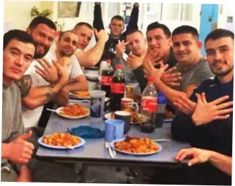  ??  ?? Prison: Albanian inmates tuck into Christmas dinner