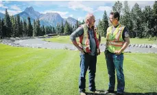  ?? THE CANADIAN PRESS/FILE ?? Golf architect Gary Browning, left, and course profession­al Bob Paley discuss the course restoratio­n last year.
