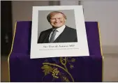  ?? ALBERTO PEZZALI — THE ASSOCIATED PRESS FILE ?? An image of murdered British Conservati­ve lawmaker David Amess is displayed near the altar in St. Peter’s Catholic Church in Leigh-on-Sea, Essex, England.