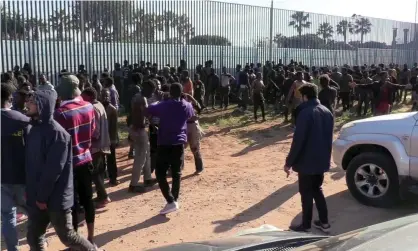  ?? Photograph: El Faro TV/AFP/Getty Images ?? Migrants arriving at a temporary centre in the Spanish exclave of Melilla, 2 March 2022.