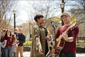  ?? CONTRIBUTE­D BY AMERICAN FAMILY INSURANCE ?? Jennifer Hudson surprised Marietta singer-songwriter Alex Guthrie at Woodruff Park in an American Family Insurance ad that has aired regularly the past seven months.