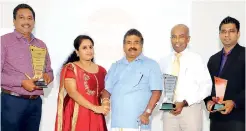  ??  ?? Winners of the Annual Dealer Awards 2019 with Tokyo Cement Company (Lanka) PLC Managing Director S.R. Gnanam