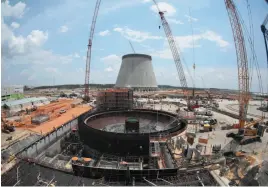  ?? AP FILE PHOTO ?? Constructi­on proceeds on the Plant Vogtle nuclear plant in Waynesboro, Ga., in 2014. Nuclear power has one of the lowest levels of carbon emissions per kilowatt-hour, but it still is not carbon free.