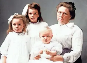  ?? INDIANA ?? This colorized photo from around 1908 shows Belle Gunness and three of her children. On n April 27, 1908, her LaPorte farmhouse burned down. Afterward, the remains of several bodies were found in the basement rubble and more bodies were discovered buried on her farm, but it remains unclear if Gunness perished.