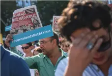  ?? AFP ?? Journalist­s marched to the courthouse from Cumhuriyet’s headquarte­rs in Istanbul yesterday