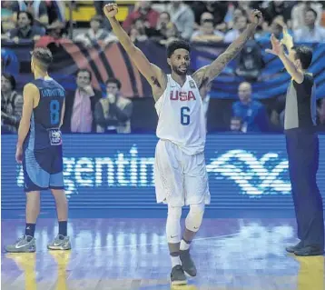  ?? EITAN ABRAMOVICH/AFP/GETTY IMAGES ?? USA point guard Larry Drew II celebrates after his team defeated Argentina during their 2017 FIBA Americas Championsh­ip final match in Cordoba, Argentina, on Sept. 3.