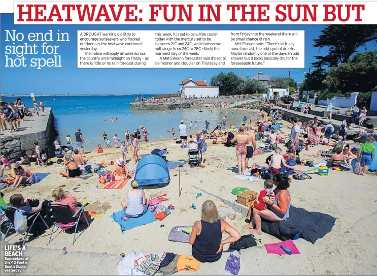  ??  ?? LIFE’S A BEACH Sunseekers at the 40 Foot in South Dublin yesterday