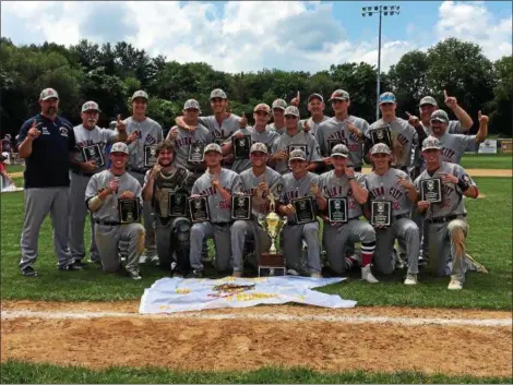  ?? THOMAS NASH — DIGITAL FIRST MEDIA ?? Members of the Spring City American Legion baseball team gather with the trophy after winning the Pa. State Tournament Championsh­ip on Wednesday afternoon at Bear Stadium. The Red Sox beat Souderton 6-1 for their first State Tournament title since 2010.