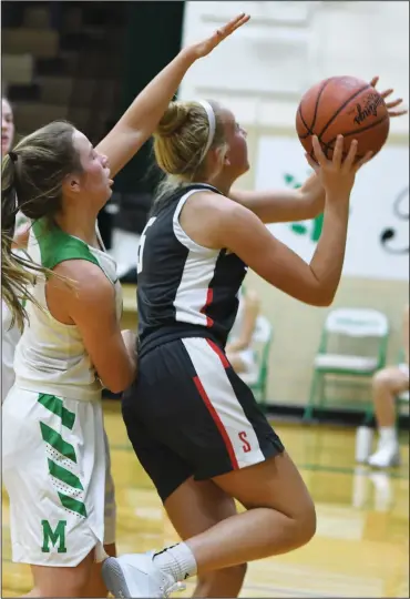  ?? CHUCK RIDENOUR/SDG Newspapers ?? Lady Whippet Audi Albert goes in for a score ahead of Margaretta defender Jaelle Keller during