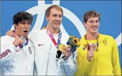  ?? USA Today Network - Robert Hanashiro ?? From left, Litherland, Kalisz and bronze medalist Brendon Smith of Australia pose with their medals following the medal ceremony Sunday.