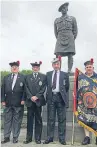  ??  ?? From left: Campaigner­s Lawrence Hutchison, Rab Wilkie, Charlie Reid and Norman Ednie at The Black Watch monument at Powrie Brae.