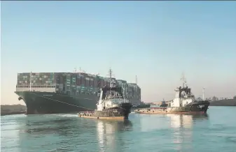  ?? Suez Canal Authority ?? Tugboats pull the Ever Given after it was freed from the banks of the Suez Canal in Egypt. The huge container ship had been stuck in the vital shipping channel since last Tuesday.