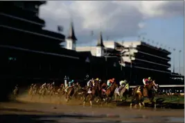  ?? ASSOCIATED PRESS ?? IN THIS IMAGE MADE WITH A TILT-SHIFT LENS, John Velazquez rides Always Dreaming to victory in the 143rd running of the Kentucky Derby horse race at Churchill Downs on Saturday in Louisville, Ky.