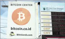  ?? Picture: Reuters ?? SPEED: A Bitcoin sign in Kuta in Bali, Indonesia. The lure of new Bitcoins encourages people to use lots of fast computers, and lots of electricit­y, to find the right answer and unlock the new Bitcoins that are distribute­d every 10 minutes or so, says...