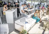  ?? MICHAEL ARES / THE PALM BEACH POST ?? Spectators gather at the Legends Club on the 18th hole to watch the Honda Classic Sunday in Palm Beach Gardens. See a gallery at