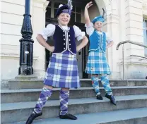  ?? PHOTO: DANIEL BIRCHFIELD ?? Double act . . . Twins Gemma (left) and Laura Aker (8) pose outside the Oamaru Opera House where they danced in the Oamaru Performing Arts Society’s 81st annual festival over the weekend.