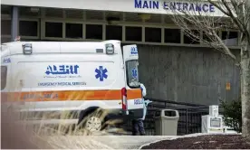  ??  ?? An ambulance outside the Soldiers’ Home in Holyoke, Massachuse­tts, where nearly 70 residents have died. Photograph: Hoang ’Leon’ Nguyen/AP