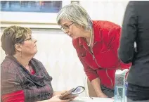  ?? RYAN TAPLIN • FILE ?? Karin Robertson, right, is speaks to a supporter at a hearing last year. Robertson testified in her own defence Thursday against charges under the Animal Protection Act.