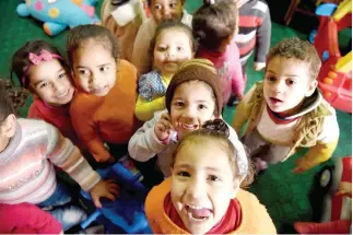  ??  ?? Egyptian children play at the Banati Foundation shelter, a civil society organizati­on that works with street children, in Cairo. (AFP)