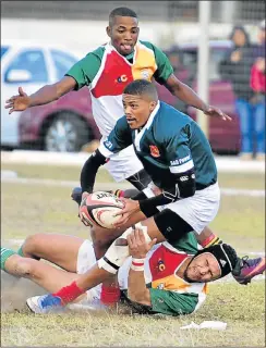  ?? Picture: EUGENE COETZEE ?? NOT SO FAST: Gardens’ Kirwan Ceasar is tackled by Harlequins’ Kurt Camdon, while Quinton Gawie looks on during their Grand Challenge match at the Derrick Ferreira Stadium