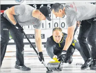  ?? TELEGRAM FILE PHOTO/KENN OLIVER ?? In this file photo from the 2015 Grand Slam of Curling Tour Challenge at the Paradise Double Ice Complex, skip Brad Jacobs releases a shot to sweepers Ryan Harnden (left) and E.J. Harnden (right). The Jacobs rink from Sault Ste. Marie, Ont., enters the...