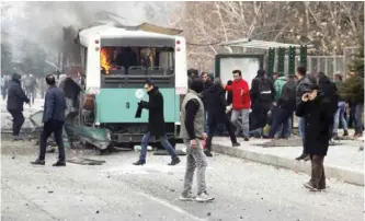  ?? — AP ?? KAYSERI: A public bus is seen burning at the scene of a car bomb attack in central Anatolian city of Kayseri, Turkey yesterday.