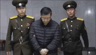  ??  ?? Canadian pastor Hyeon Soo Lim, centre, is escorted to his sentencing in Pyongyang, North Korea, on Dec. 16, 2015.