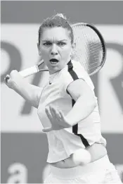  ?? KEVORK DJANSEZIAN/GETTY IMAGES ?? Simona Halep, of Romania, hits a forehand against Wang Qiang, of China, on Tuesday at Indian Wells, Calif.