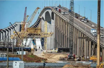  ?? Mark Mulligan / Staff photograph­er ?? Constructi­on of the new Ship Channel Bridge, seen Jan. 7, along the Sam Houston Tollway was halted last year. Concerns about sliding on the new span prompted officials to briefly close traffic Thursday on the adjacent bridge.