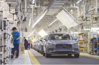  ?? (Stringer/Reuters) ?? VOLVO WORKERS seen near an assembly line at the Volvo Cars manufactur­ing plant in China. Volvo will invest in Tel Avivbased companies UVeye and MDGo.