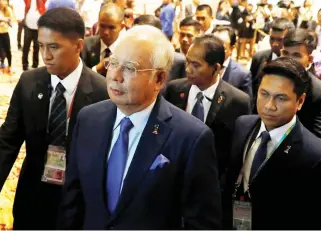  ??  ?? Malaysian Prime Minister Najib Razak arrives to address a forum ahead of the ASEAN summit in Manila. (Reuters)