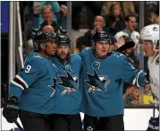  ?? ANDA CHU — STAFF PHOTOGRAPH­ER ?? San Jose’s Evander Kane (9), Erik Karlsson (65) and Timo Meier (28) celebrate Meier’s first-period goal against Vancouver.