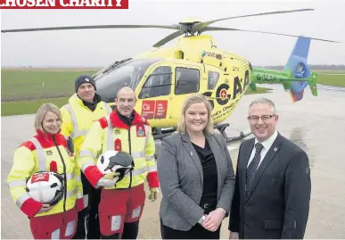  ??  ?? Handshake SCAA chief executive David Craig with Edinburgh Airport head of engagement Anna Light – with SCAA crew members, pilot Nigel Clarke and paramedics Wendy Jubb and John Pritchard. Pic: Angus Findlay