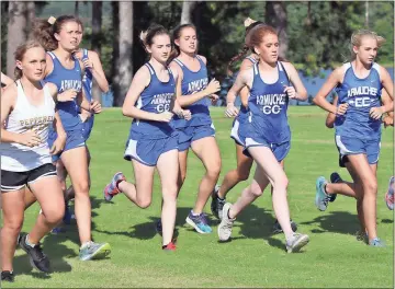  ?? Tommy Romanach / Rome News-Tribune ?? Runners start out onto the 5K course at Georgia Highlands College for the girls’ race of the Floyd County Championsh­ips.