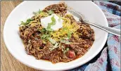  ?? ?? Don’t forget the shredded cheddar and/or sour cream to top off this fire-roasted tomato chili con carne.