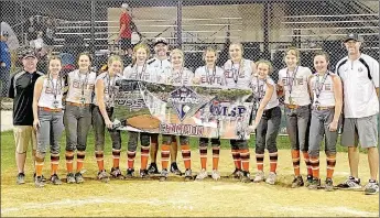  ?? SUBMITTED PHOTO ?? Brinkley Moreton (center next to coach) celebrates winning the Oklahoma City Challenge Softball tournament May 31 as a member of the Tulsa Elite NWA 06 traveling softball team. Brinkley alternates with two others as pitchers on the team. She is a rising eighth-grader at Lincoln Junior High.