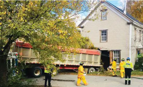 ?? NOVA SCOTIA RCMP ?? A tractor-trailer sits partly inside a house near Cambridge, N.S., after a collision on Wednesday. No one was inside the home at the time.