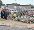  ?? CAROLYN THOMPSON/AP ?? Attorney General Merrick Garland visits the Tops Friendly Market grocery store in Buffalo, N.Y., on Wednesday.