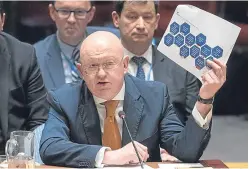  ?? Picture: AP. ?? Russian Ambassador to the United Nations Vasily Nebenzya holds up a British report on the Salisbury incident as he speaks at the United Nations.