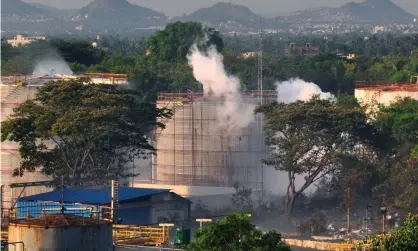  ??  ?? Smoke rises from the chemical factory in Visakhapat­nam on Thursday. Photograph: EPA