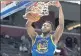  ?? CARLOS OSORIO — THE ASSOCIATED PRESS ?? Golden State Warriors forward Andrew Wiggins dunks during the second half Friday against the Detroit Pistons in Detroit.