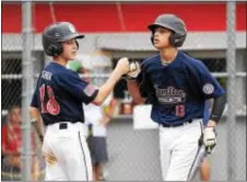  ?? JOHN BLAINE — FILE PHOTO — FOR THE TRENTONIAN ?? Nate Rodriguez, right, scored the winning run for the Hamilton 14s in their World Series opener Thursday against Connecticu­t.