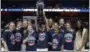  ?? JESSICA HILL — ASSOCIATED PRESS ?? Connecticu­t women’s basketball team poses with the American Athletic Conference championsh­ip trophy after defeating South Florida.