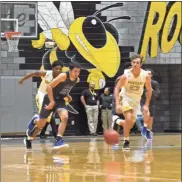  ?? / Lorene Parker ?? The Jackets kept up a fast pace over Model throughout the game on Friday, Dec. 14. It was their first outing of the season after an extended run through the GHS Class AA football playoffs.